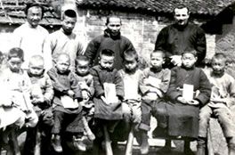 Columban Fr. Dan Lucey with school children at the Hao Pi Mission in Keangsi