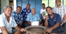 A group of Fijian men sitting around the yaqona bowl